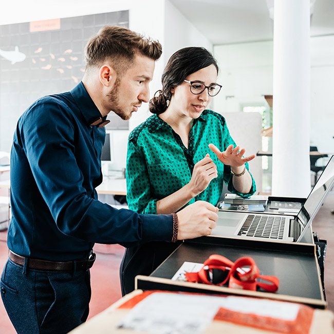 A group of startup business employees working together in a modern office environment.