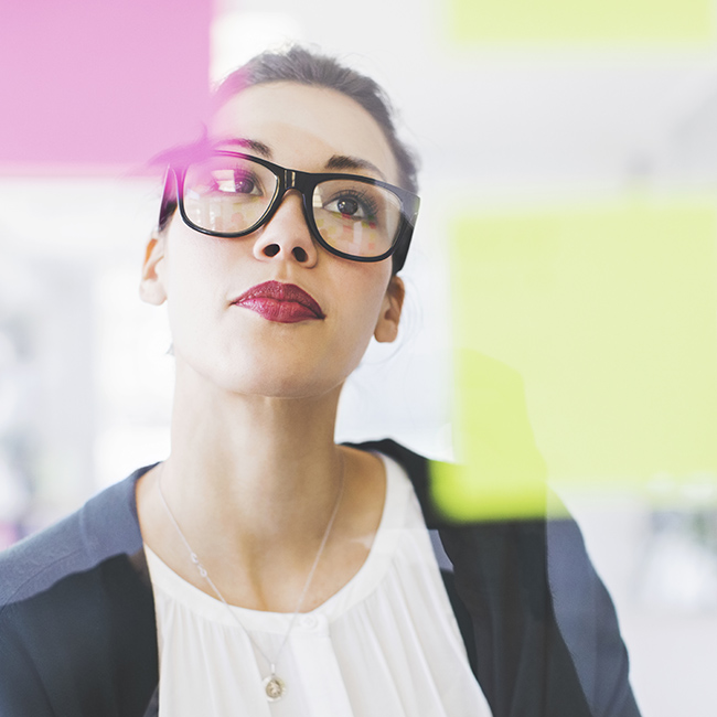 A professional woman contemplates options before making a choice