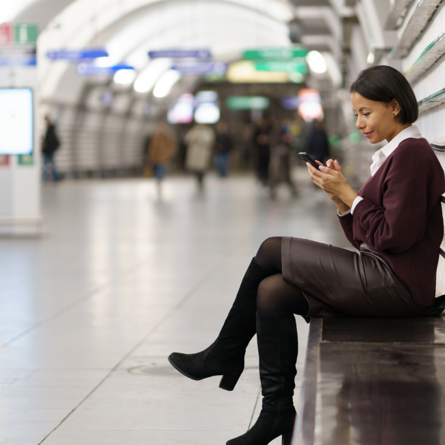 Serene image of a woman gracefully resting on a bench, surrounded by a serene and picturesque environment.